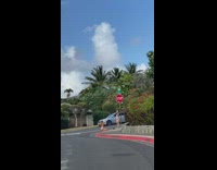 Woman blue bikini stop sign sidewalk pictorial