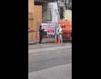 Construction guy hold hammer shake behind truck
