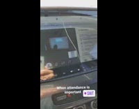 Guy attending online lecture on car while driving
