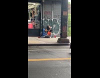 Lady twerks next to store doing splits 