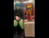 Women wearing mcdonald and alien costume on subway