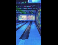 Guy get strike on another lane bowling