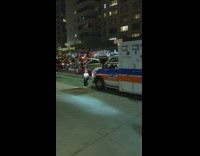 Guy stands in front of ambulance 