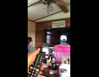 Girl turns off television during video game 