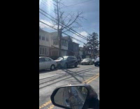 Ladies drives around street sit on sunroof