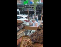 Guy shakes lighter to get final flicker