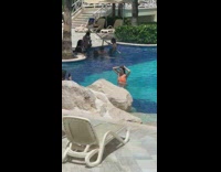 Woman orange bikini swimming pool photo shoot Part 1