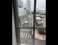 Man rides bicycle carries drum on head