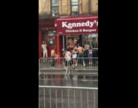 Two shirtless guys wet shirt whip street