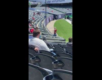 Blonde girl red shirt soccer stadium bleachers