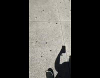 Woman follows sidewalk chalk directions 