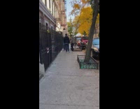 Tall guy with big feet walks on the street 