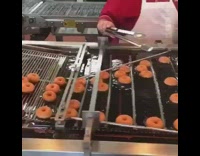 krispy kreme glazed donuts made in machine