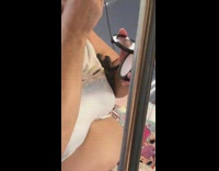 Woman puts a bunch of powder make up on face on subway train