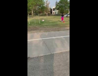 Woman pink leggings  carry two orange bottle
