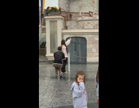 Disneyland castle blocking families for photoshoot