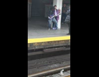 Collab Subway Creatures - Guy plays bass guitar in subway station as woman records