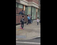Kids look through garbage bin
