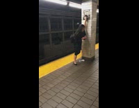 Woman Puts Foot Above Head and Texts on Subway Platform