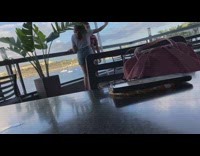 Couple selfie restaurant patio ocean water view