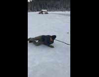 man playing hockey falls on hip on ice