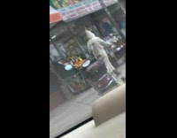 Guy wearing white ku klux klan robe