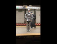 Man in knight costume at train station