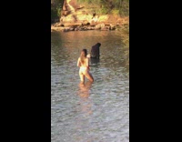 Woman white bikini beach sunset wet blanket