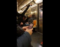 Man jacket hoodie performs in subway train