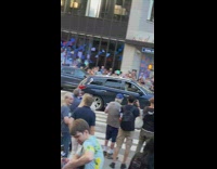 Giant mascot walks across the street in new york 