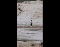 Man white top music video shoot motorcycle