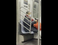 Woman water bottle on head ride subway