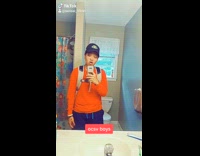 Guy orange shirt flexes in Nike slides, bracelet, backpack, Nike water bottle, ocsv boys