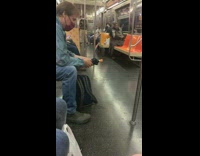 person rubs their body with a lemon sitting on train