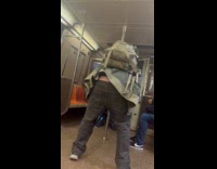 Guy dance on subway pants almost off