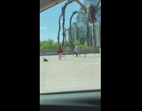 Couple kiss hug under giant spider statue