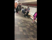 Old man sings The Lion Sleeps Tonight on microphone speakers in subway station