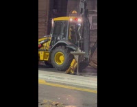 Construction truck dig the street at night