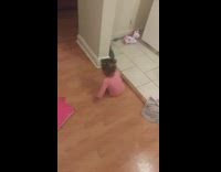 Baby girl slips and falls on toy 