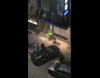 Guys park car on sidewalk for photoshoot 