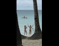 Two women bikini unsynchronized tiktok dance beach