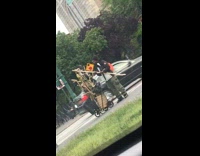 Guy sands wooden stick with sandpaper on sidewalk