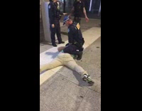 Man yells Suck me harder big boy at police officer putting handcuffs onto criminal pinned on the ground