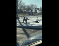 Man tiktok dance at snowy street corner