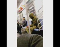 Camouflage print jacket orange backpack plastic bag