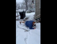 Man slips on slippery snow 