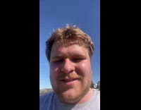 Guy finds sticker on sprinkler funny 