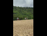 Two women tiktok dance behind two men