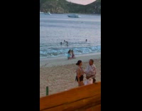 Woman poses then twerks for beach video