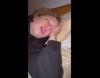 Guy green shirt singing while girlfriend sleeps mouth open